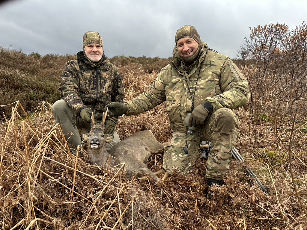 2 hunters with their kill